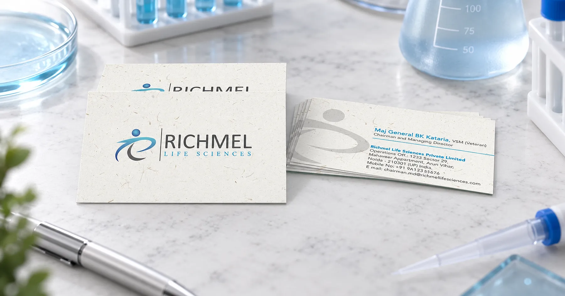 Richmel Life Sciences identity and business card design — healthcare & wellness, India